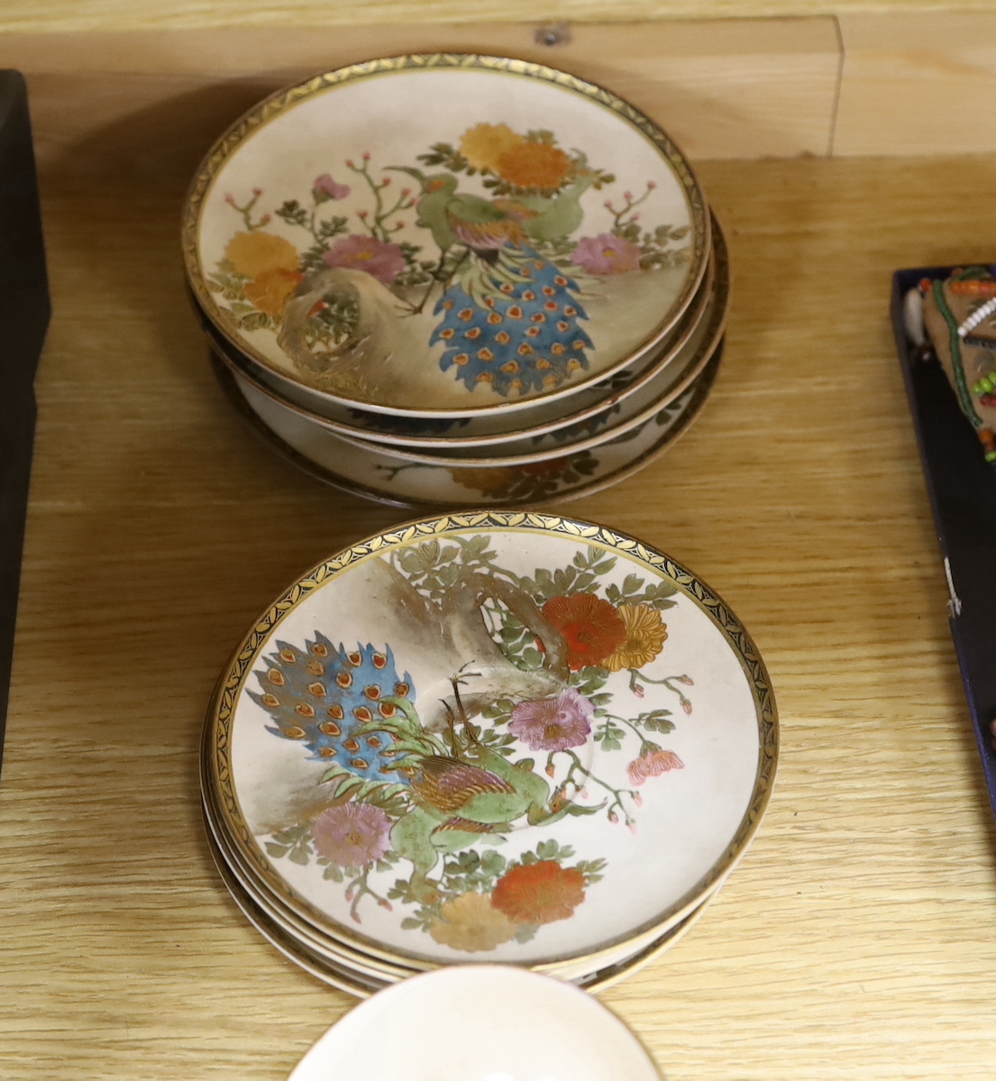 A Satsuma tea service comprising teapot, cream jug, sugar pot, four plates and four cups with saucers